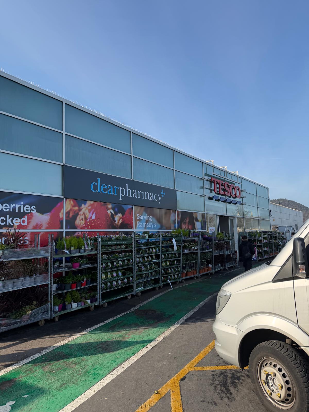 Commercial frontage with planted displays being maintained